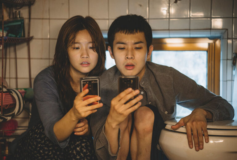 Ki-jung Kim (So-dam Park) and Ki-woo Park (Woo-sik Choi) in "Parasite." (Courtesy of NEON + CJ Entertainment)