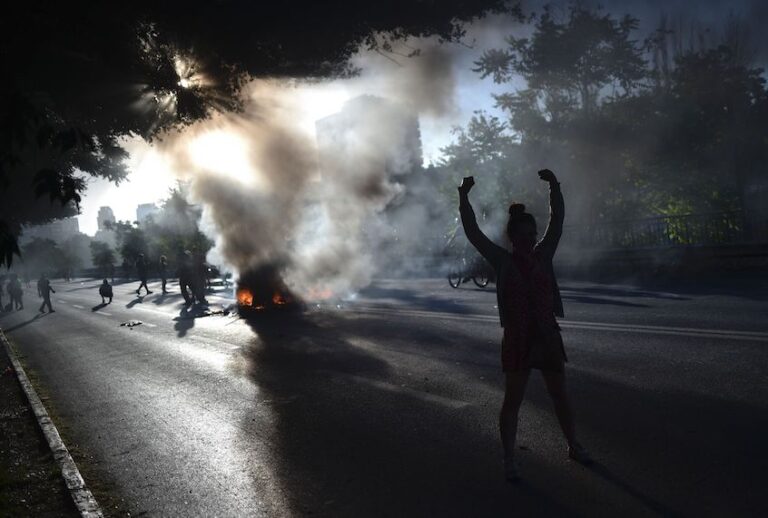 People demonstrate by a bonfire during a protest against the government in Santiago on November 15, 2019. (Rodrigo Arangua/AFP via Getty Images)