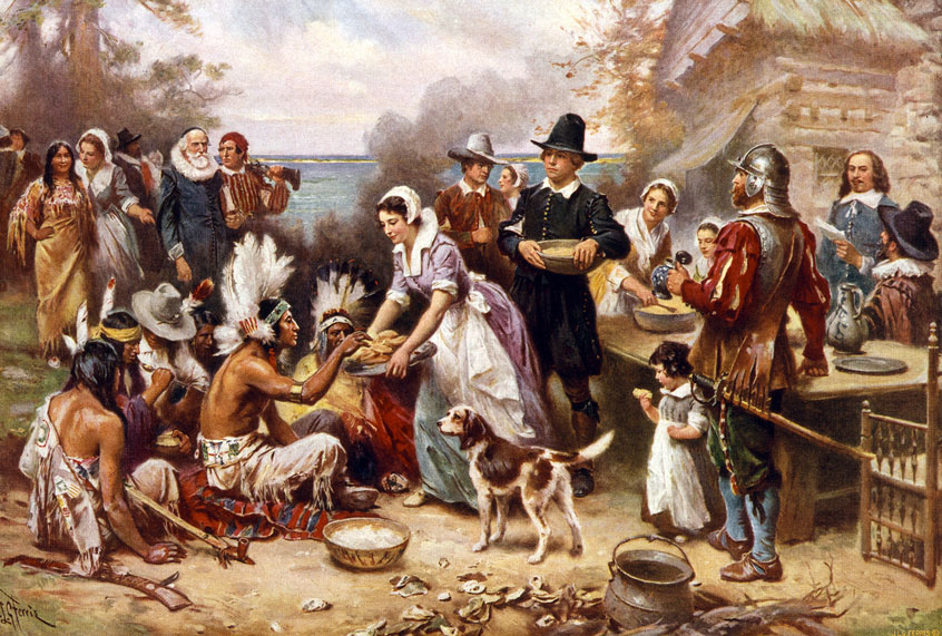 The First Thanksgiving, 1621 by Jean Leon Gerome Ferris, 1863-1930, artist. Published by the Foundation Press, Inc., c1932. Photomechanical print halftone, colour. Pilgrims and Natives gather to share meal. (Photo by: (Photo12/Universal Images Group via Getty Images)