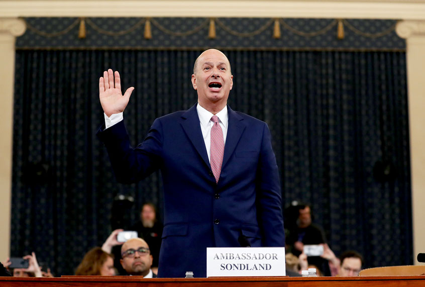 U.S. Ambassador to the European Union Gordon Sondland is sworn in to testify before the House Intelligence Committee on Capitol Hill in Washington, Wednesday, Nov. 20, 2019. (AP Photo/Andrew Harnik)