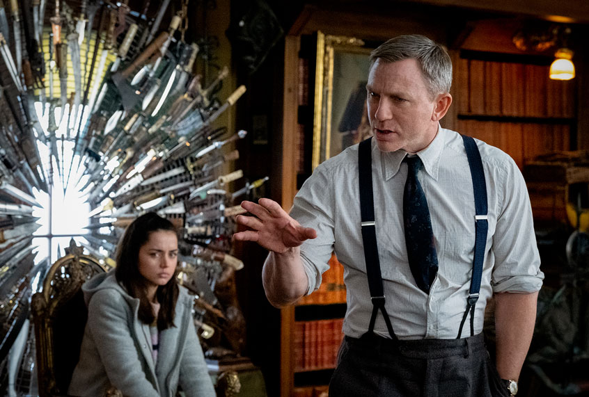 Ana De Aramas as 'Marta Cabrera' and Daniel Craig as "Benoit Blanc' in KNIVES OUT. (Lionsgate/Claire Folger)