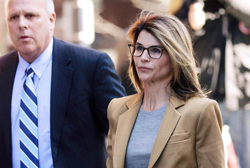 Lori Loughlin arrives at federal court in Boston on Wednesday, April 3, 2019, to face charges in a nationwide college admissions bribery scandal. (AP Photo/Steven Senne)