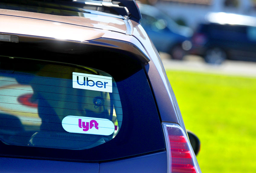 The Lyft logo is displayed on a car on March 11, 2019 in San Francisco, California. On-demand transportation company Lyft has filed paperwork for its initial public offering that is expected to value the company at up to $25 billion. (Justin Sullivan/Getty Images)