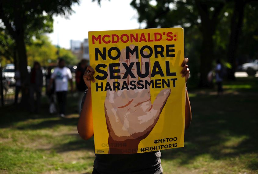 A McDonald's employee holds a sign during a protest against sexual harassment in the workplace on September 18, 2018 in Chicago, Illinois. - McDonald's workers in 10 US cities staged a one-day strike Tuesday inspired by the #MeToo movement, alleging the fast-food giant does not adequately address pervasive sexual harassment at its stores. (Photo by Joshua Lott / AFP)        (Photo credit should read JOSHUA LOTT/AFP via Getty Images) (Joshua Lotti/AFP via Getty Images)