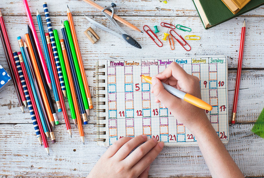 Personalizing a paper planner. (Getty Images)