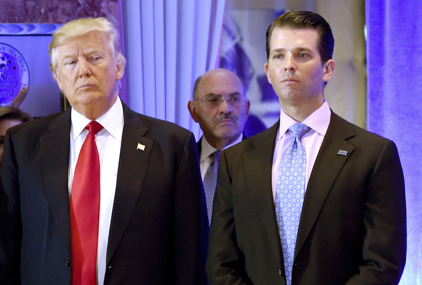 Donald Trump along with his son Donald, Jr., arrive for a press conference at Trump Tower in New York, as Allen Weisselberg (C), chief financial officer of The Trump, looks on January 11, 2017. (Timothy A. Clary/AFP via Getty Images)