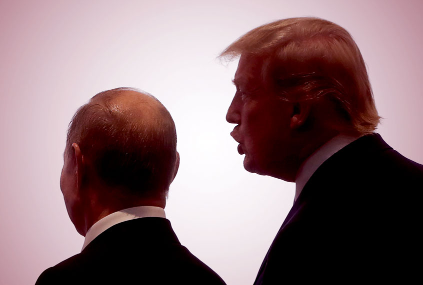 Russia's President Vladimir Putin (L) and US President Donald Trump pose at an official meeting ceremony for the heads of delegations from the G20 member countries, invited guests and international organisations participating in the 2019 G20 Summit at the INTEX Osaka International Exhibition Centre. (Mikhail MetzelTASS via Getty Images)