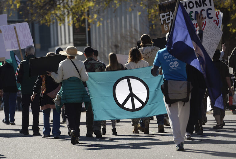 Members of Veterans for Peace and About Face: Veterans Against the War, march down Lincoln Street during the Denver Veterans Day Parade, hosted by the Colorado Veterans Project in downtown on November 11, 2017 in Denver, Colorado. The parade, comprised of local veterans organizations, lines Civic Center Park and nearby streets and is broken down into serials that represent a different conflict in military history. (Kathryn Scott/The Denver Post via Getty Images)