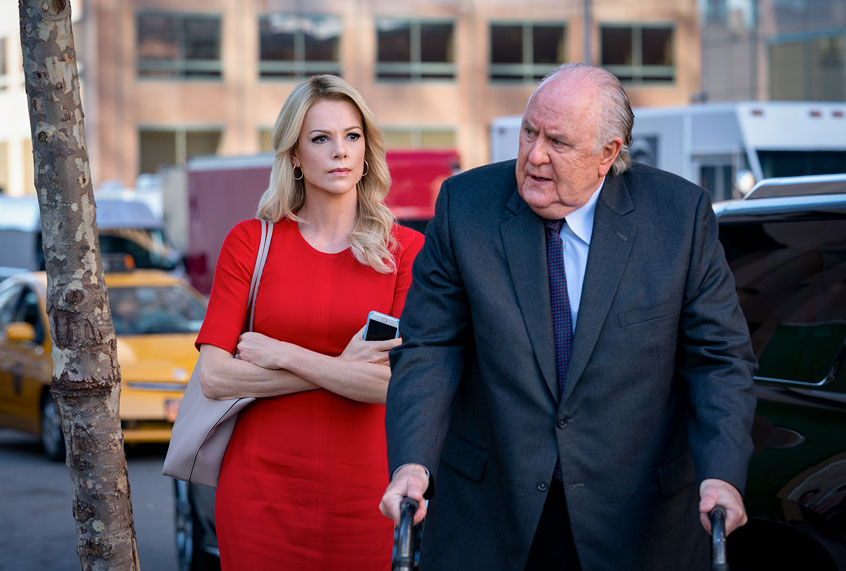 Charlize Theron as 'Megyn Kelly' and John Lithgow as 'Roger Ailes' in BOMBSHELL. (Hilary Bronwyn Gayle SMPSP)