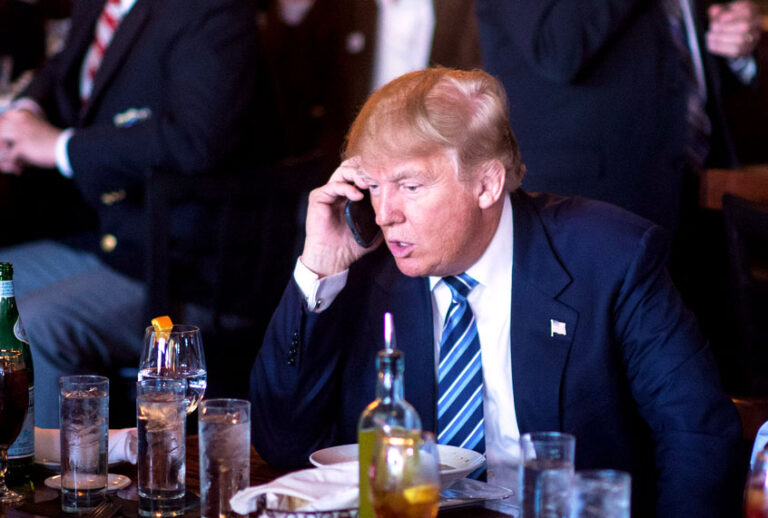 Republican presidential candidate Donald Trump talks talks on the phone while making a stop for lunch between campaign events at Fratello's Italian Tavern in North Charleston, SC on Thursday Feb. 18, 2016. (Jabin Botsford/The Washington Post via Getty Images)