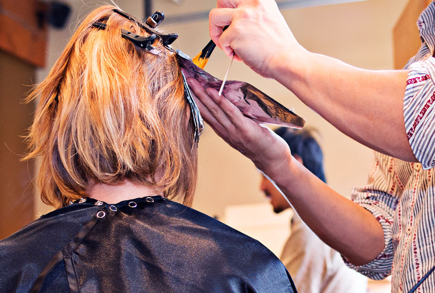Woman having her hair colored in salon (Getty Images)