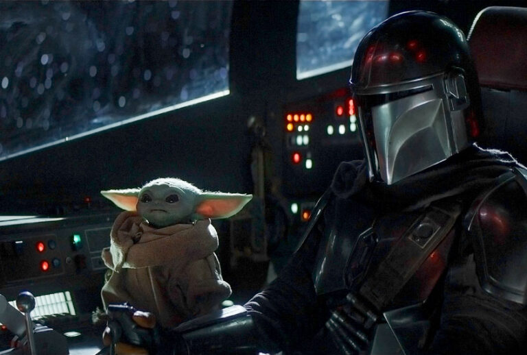 The Mandalorian (Pedro Pascal) and the Child in THE MANDALORIAN (Disney+)