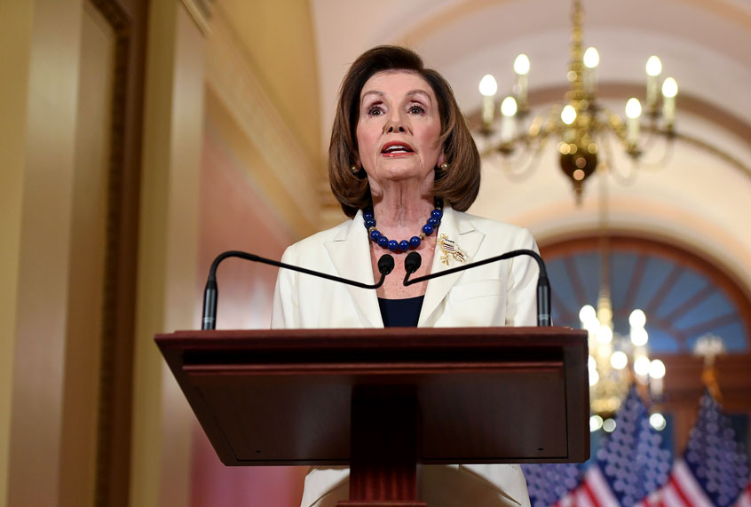 Pelosi told congressional leaders to draw up articles of impeachment against Trump, saying his abuse of power for political benefit "leaves us no choice but to act." Trump "has engaged in abuse of power, undermined our national security and jeopardized the integrity of our elections," she said, adding that "the president leaves us no choice but to act." (SAUL LOEB/AFP via Getty Images)