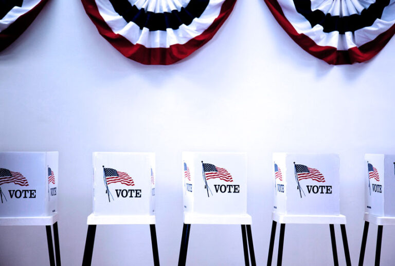 Voting booths in polling place (Getty Images/Hill Street Studios)