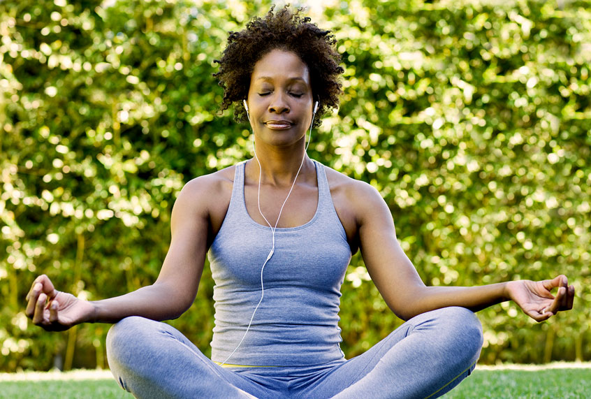 Woman meditating (Patrik Giardino/Getty Images)