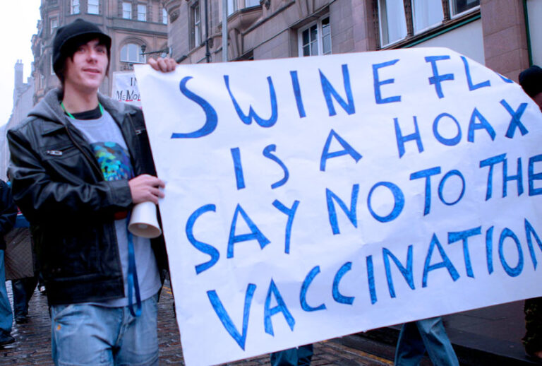 Protesters march to the Scottish Parliament in an "anti-swine flu vaccination protest" along the Royal Mile Edinburgh. (David Cheskin/PA Images via Getty Images)