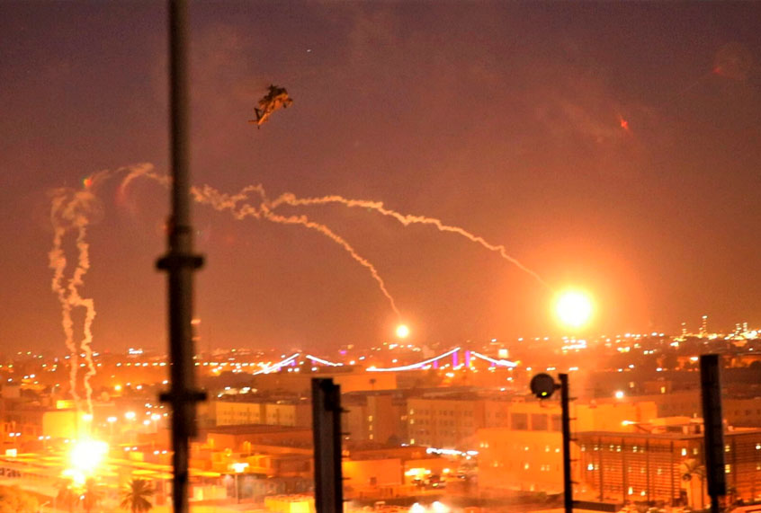 In this photo provided by U.S. Department of Defense, the Army's AH-64 Apache helicopter from 1st Battalion, 227th Aviation Regiment, 34th Combat Aviation Brigade, conducts overflights of the U.S. Embassy in Baghdad, Iraq, Tuesday, Dec. 31, 2019. The helicopters launched flares as a show of presence while providing additional security and deterrence against protesters. (U.S. Army photo by Spc. Khalil Jenkins, CJTF-OIR Public Affairs via AP)