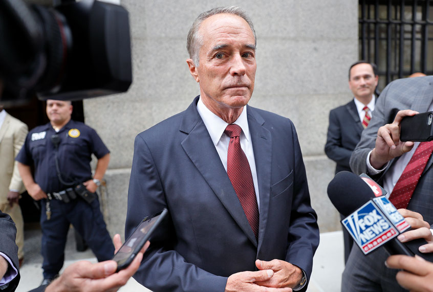 U.S. Rep. Chris Collins, R-N.Y., speaks to reporters as he leaves the courthouse after a pretrial hearing in his insider trading case, in New York. Lawyers for the ex-U.S. congressman say he is humbled and remorseful after pleading guilty to conspiracy in an insider trading scheme and should face no time behind bars. Sentencing is set for Jan. 17. (AP Photo/Seth Wenig)