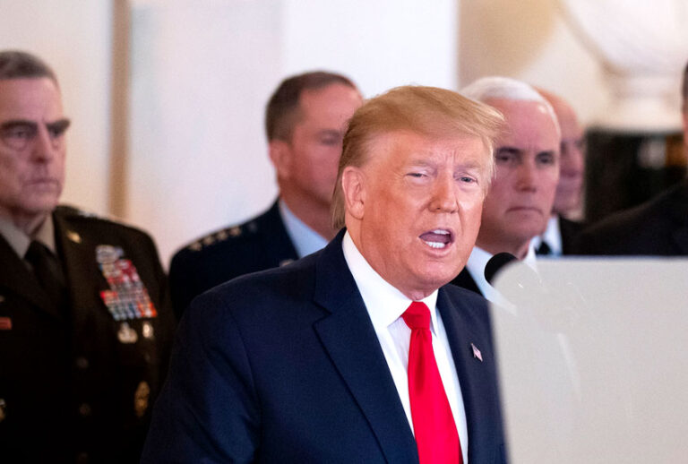 President Donald Trump addresses the nation from the White House on the ballistic missile strike that Iran launched against Iraqi air bases housing U.S. troops, Wednesday, Jan. 8, 2020, in Washington, accompanied by Vice President Mike Pence, Secretary of State Mike Pompeo, and others. (AP Photo/Alex Brandon)