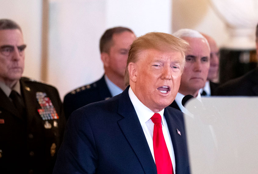President Donald Trump addresses the nation from the White House on the ballistic missile strike that Iran launched against Iraqi air bases housing U.S. troops, Wednesday, Jan. 8, 2020, in Washington, accompanied by Vice President Mike Pence, Secretary of State Mike Pompeo, and others. (AP Photo/Alex Brandon)