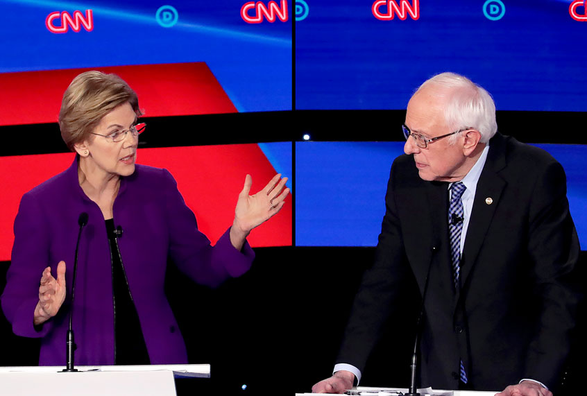 Sen. Elizabeth Warren (D-MA) speaks as Sen. Bernie Sanders (I-VT) (R) listen during the Democratic presidential primary debate at Drake University on January 14, 2020 in Des Moines, Iowa. Six candidates out of the field qualified for the first Democratic presidential primary debate of 2020, hosted by CNN and the Des Moines Register. (Scott Olson/Getty Images)