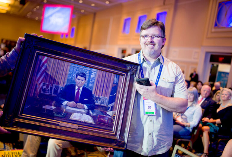 Painter Jon McNaughton shows off a portrait of President Reagan at a taping of Sean Hannity's Fox News TV show during the Conservative Political Action Conference at the Gaylord National Resort and Convention Center February 23, 2017 in National Harbor, Maryland. Hosted by the American Conservative Union, CPAC is an annual gathering of right wing politicians, commentators and their supporters. (Zach D Roberts/NurPhoto via Getty Images)