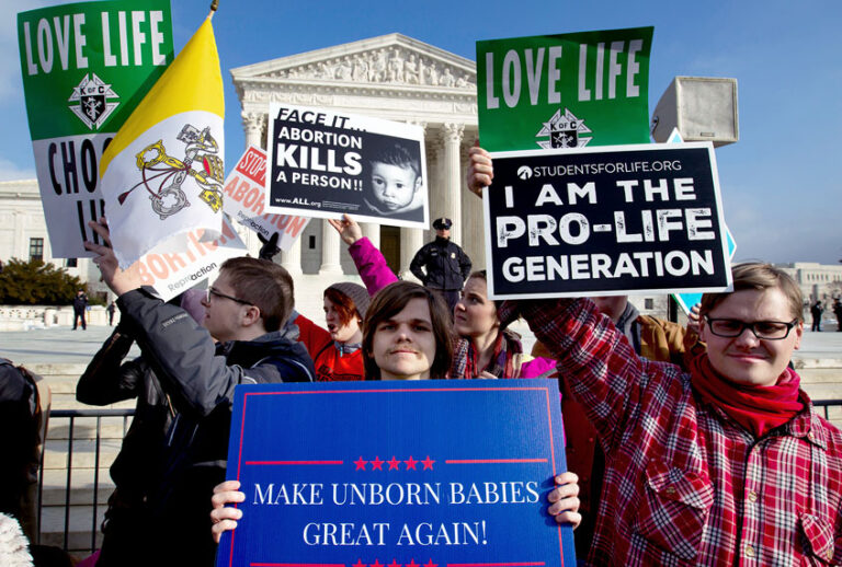 In this Friday, Jan. 18, 2019 file photo, anti-abortion activists protest outside of the U.S. Supreme Court, during the March for Life in Washington. President Trump's call for a ban on late-term abortions is unlikely to prevail in Congress, but Republican legislators in several states are pushing ahead with tough anti-abortion bills of their own that they hope can pass muster with the reconfigured U.S. Supreme Court. (AP Photo/Jose Luis Magana)