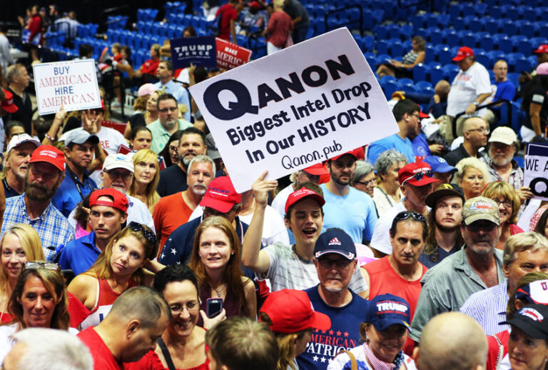 Trump supporters displaying QAnon posters appeared at President Donald J. Trumps Make America Great Again rally (Thomas O'Neill/NurPhoto via Getty Images)