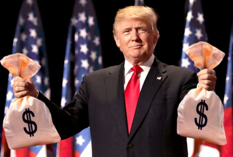 Donald Trump holding bags of money (Getty Images/Salon)