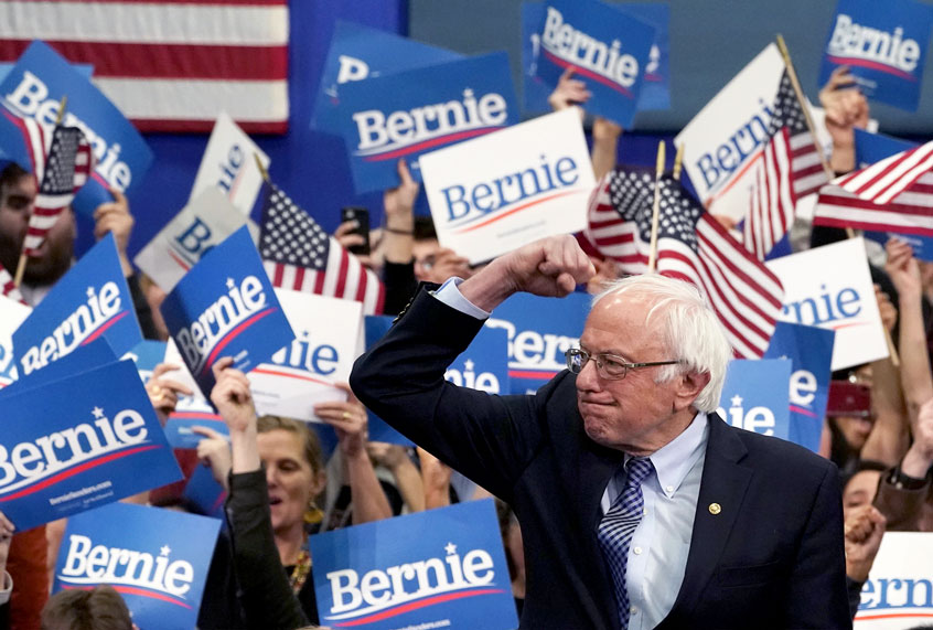 Democratic presidential hopeful Vermont Senator Bernie Sanders arrives to speak at a Primary Night event at the SNHU Field House in Manchester, New Hampshire on February 11, 2020. - Bernie Sanders won New Hampshire's crucial Democratic primary, beating moderate rivals Pete Buttigieg and Amy Klobuchar in the race to challenge President Donald Trump for the White House, US networks projected. (TIMOTHY A. CLARY/AFP via Getty Images)