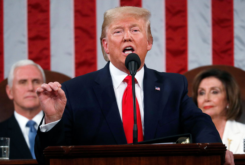 President Donald Trump delivers his State of the Union address to a joint session of Congress in the House Chamber on Capitol Hill in Washington, Tuesday, Feb. 4, 2020, as Vice President Mike Pence and Speaker Nancy Pelosi look on. (Leah Millis/Pool via AP)