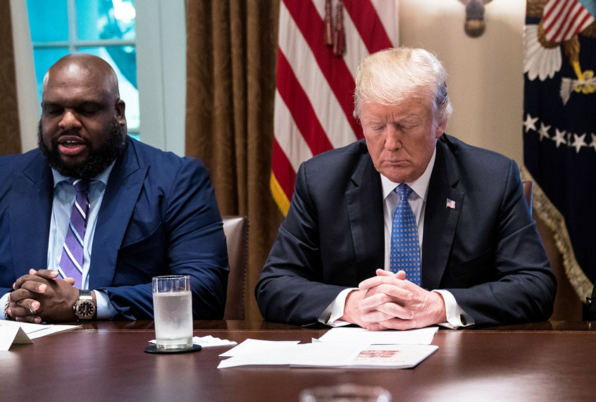President Donald J. Trump bows his head during a prayer at a meeting with inner city pastors in the Cabinet Room of the White House on Wednesday, Aug 01, 2018 in Washington, DC. (Donald Trump)