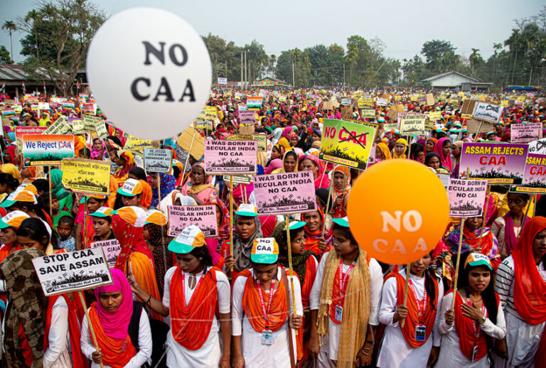 Indian Muslim women participate in a rally to protest against a new citizenship law in Rupahi hat village, east Gauhati, India, Sunday, Feb. 16, 2020. The law fast-tracks naturalization for non-Muslim migrants from neighboring Pakistan, Bangladesh and Afghanistan who are living in the country illegally. (AP Photo/Anupam Nath)