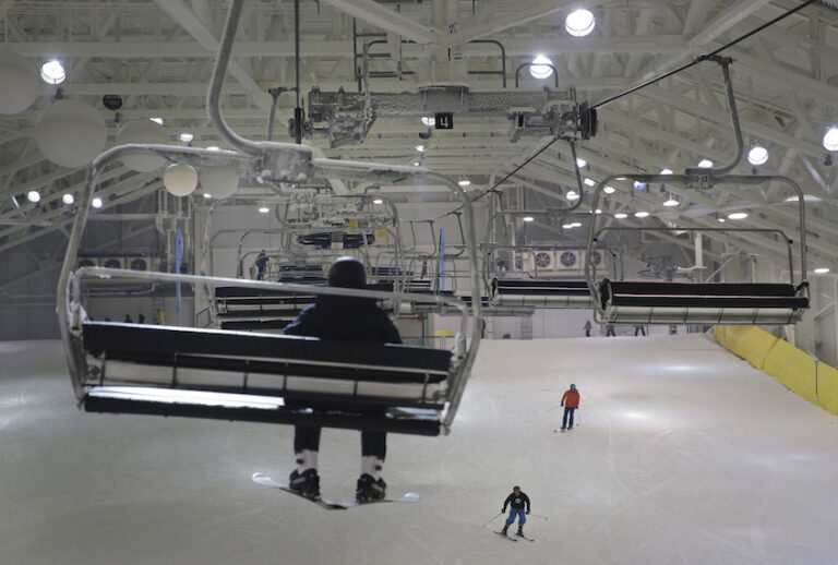 Snowboarders and skiers enjoy the grand opening of Big Snow in East Rutherford, N.J., Thursday, Dec. 5, 2019. The facility, which is part of the American Dream mega-mall, is North America's first indoor ski and snowboard facility with real snow. (AP Photo/Seth Wenig)