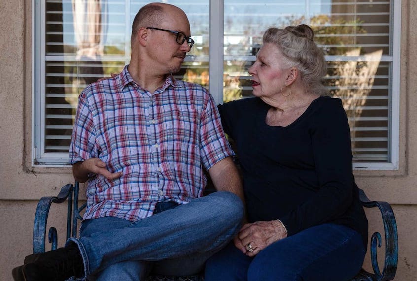 Joyce Daubert and her son Jason in front of Joyce’s home in Ramona, California. (Ariana Drehsler/Undark)
