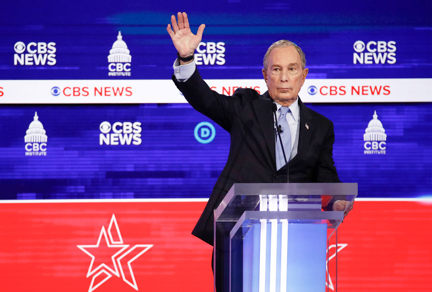 Democratic presidential candidates, former New York City Mayor Mike Bloomberg, raises his hand during the Democratic presidential primary debate at the Gaillard Center, Tuesday, Feb. 25, 2020, in Charleston, S.C., co-hosted by CBS News and the Congressional Black Caucus Institute. (AP Photo/Patrick Semansky)