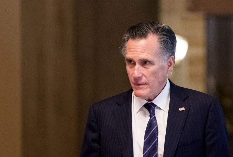 Sen. Mitt Romney (R-UT) returns to the Senate floor following a recess in the Senate impeachment trial of President Donald Trump (Samuel Corum/Getty Images)