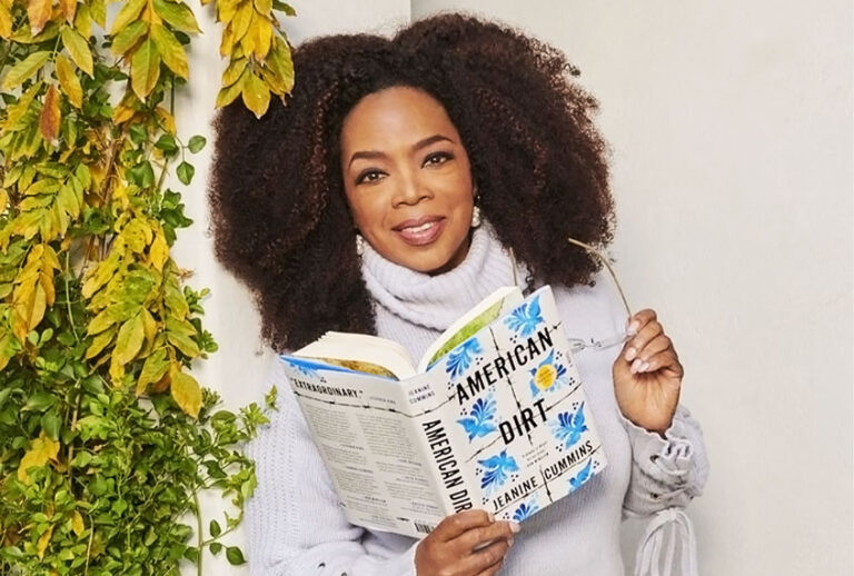 Oprah holding "American Dirt" by Jeanine Cummins (Apple)