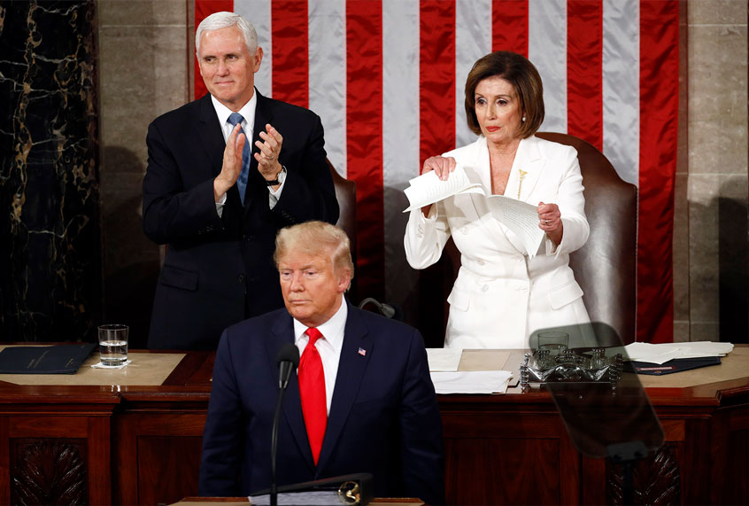 House Speaker Nancy Pelosi of Calif., tears her copy of President Donald Trump's s State of the Union address after he delivered it to a joint session of Congress on Capitol Hill in Washington, Tuesday, Feb. 4, 2020. Vice President Mike Pence is at left. (AP Photo/Patrick Semansky)