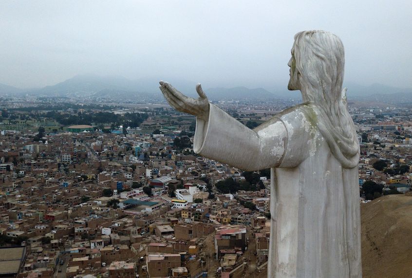 View of the "Christ of the Pacific" statue atop a hill in Lima, on July 15, 2019. The giant statute of Jesus Christ that looms large over Lima has caused controversy in Peru because of its financing by the graft-tainted Brazilian construction giant Odebrecht and late ex-president Alan Garcia. (Cris Bouroncle/AFP via Getty Images)