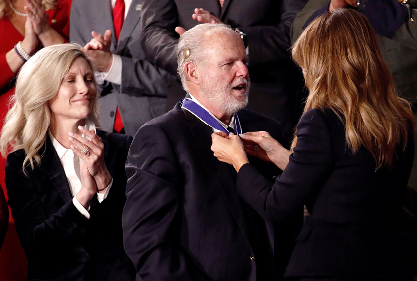 First Lady Melania Trump presents the Presidential Medal of Freedom to Rush Limbaugh as his wife Kathryn watches during the State of the Union address to a joint session of Congress on Capitol Hill in Washington, Tuesday, Feb. 4, 2020. (AP Photo/Patrick Semansky)