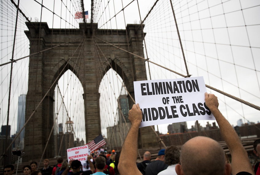 Following a rally in Brooklyn's Cadman Plaza Park, hundreds of union members march across the Brooklyn Bridge in support of IBEW Local 3 (International Brotherhood of Electrical Workers), September 18, 2017 in New York City. (Drew Angerer/Getty Images)