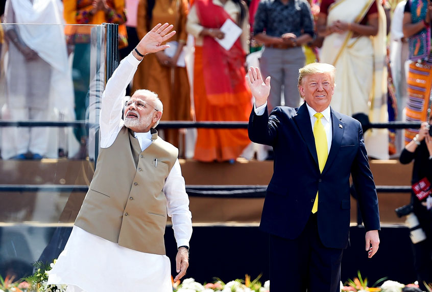 US President Donald Trump (R) and India's Prime Minister Narendra Modi wave at the crowd during 'Namaste Trump' rally at Sardar Patel Stadium in Motera, on the outskirts of Ahmedabad, on February 24, 2020. (MONEY SHARMA/AFP via Getty Images)