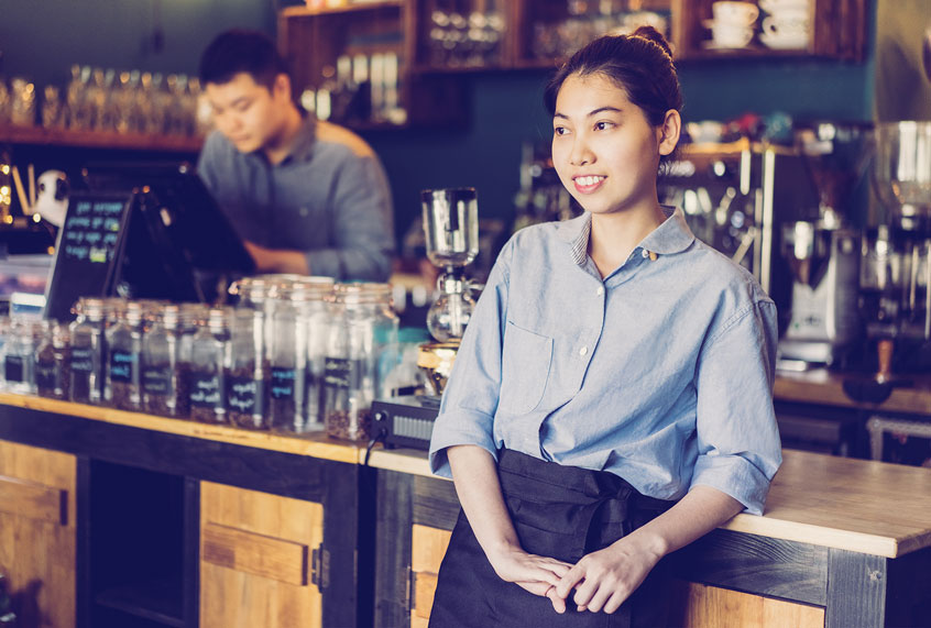 Young woman working in coffee house (Getty Images)