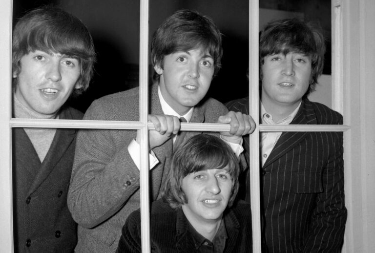 TWICKENHAM - DECEMBER 1965: (L-R) English musician, singer, songwriter and guitarist George Harrison (1943-2001), English singer, songwriter and bassist Paul McCartney, English singer, songwriter and guitarist John Lennon (1940-1980), and English musician, singer and drummer Ringo Starr (below), at Twickenham Studios promoting the release of The Beatles' "Rubber Soul" during December 1965 in London, UK. (Jeff Hochberg/Getty Images)