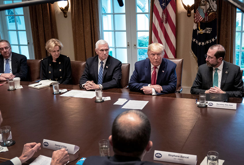 Flanked by U.S. Vice President Mike Pence (L) and Secretary of Health and Human Services Alex Azar, U.S. President Donald Trump leads a meeting with the White House Coronavirus Task Force and pharmaceutical executives in Cabinet Room of the White House on March 2, 2020 in Washington, DC. President Trump and his Coronavirus Task Force team met with pharmaceutical companies representatives who are actively working to develop a COVID-19 vaccine. (Drew Angerer/Getty Images)