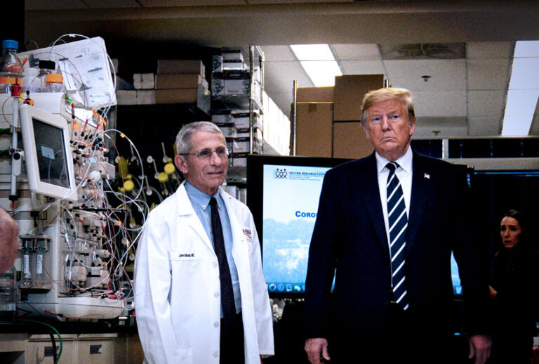 President Donald Trump tours the Viral Pathogenesis Laboratory at the National Institutes of Health, Tuesday, March 3, 2020, in Bethesda, Md., with Anthony Fauci, head of the National Institute of Allergy and Infectious Diseases at the National Institutes of Health. (AP Photo/Evan Vucci)