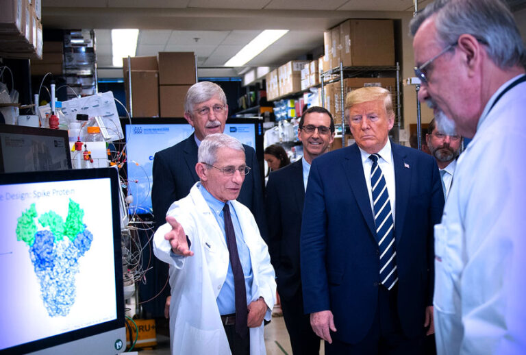 National Institute of Allergy and Infectious Diseases Director Tony Fauci (L) speaks to US President Donald Trump during a tour of the National Institutes of Health's Vaccine Research Center March 3, 2020, in Bethesda, Maryland. - The US Federal Reserve announced an emergency rate cut responding to the growing economic risk posed by the coronavirus epidemic after the UN health agency said the world has entered "uncharted territory" with the outbreak's rapid spread. (Brendan Smialowski/AFP via Getty Images)