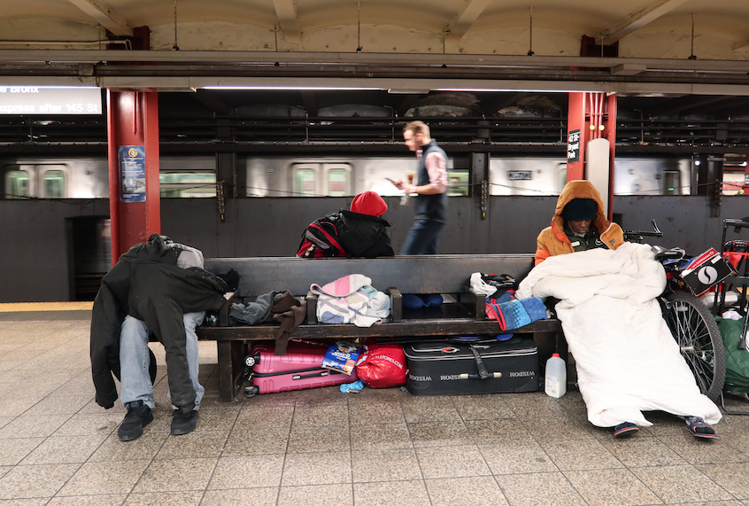 Homeless people sleep in the 42nd St-Bryant Park Subway station on March 9, 2020 in New York City. (Gary Hershorn/Corbis via Getty Images)