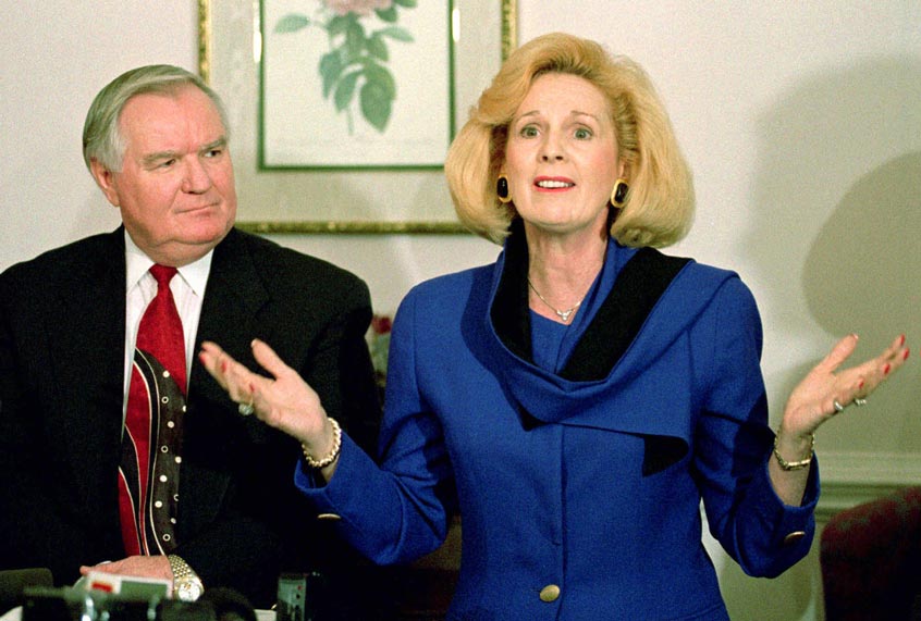 Word of Faith Fellowship church leader Jane Whaley talk to members of the media as husband Sam listens during a news conference in Spindale, N.C., Thursday, March 2, 1995. (AP Photo/Chuck Burton)
